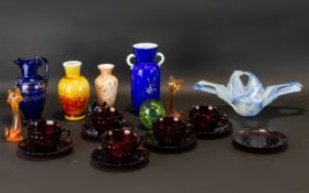 A Collection Of Decorative Glass Items To include five red moulded carnival glass cups and saucers,