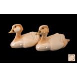 A Pair Of Art Deco Style Mandarin Duck Figures Each set amber glass eyes,
