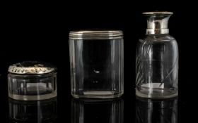 Two Silver Topped Glass Vanity Jars To include pin jar and powder jar - all hallmarks rubbed.