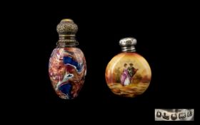 Two Antique Silver Topped Scent Bottles The first of circular flask form in ceramic with painted