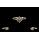 A 9ct Gold Diamond Cluster Ring Fully hallmarked, ring size J.