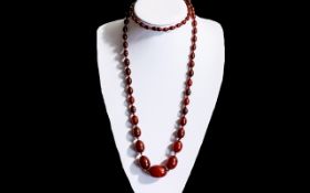 Superb 1920's Long Red Cherry Amber Graduated Beaded Necklace - of wonderful rich colour.