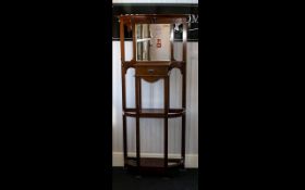 A Late 19th/Early 20th Century Hall Stand Of Typical form with central bevelled glass mirror,