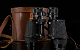 A Pair of Binoculars in Leather Case. Maker Denhill, made in France. Complete with leather neck