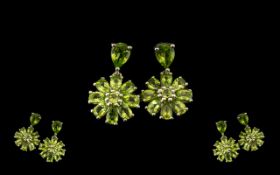 Peridot Flower Drop Earrings, each comprising a ring of pear cut peridots surrounding a round cut,