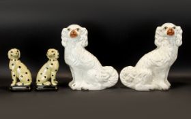 A Pair Of Large Staffordshire Style Glazed Spaniel Figures Of traditional form,