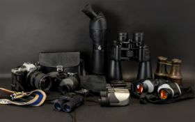 A Collection of Cameras and Binoculars.