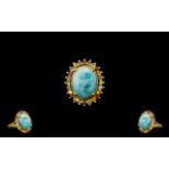 Larimar and Green, Yellow and Sunset Sapphire Ring, a 10ct cabochon of the natural, opaque,