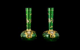 A Pair Of Continental Glass Bud Vases Specimen form vases in emerald green glass, each profusely
