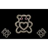 9ct White Gold Diamond And Ruby Set Pendant In The Form Of A Teddybear Fully hallmarked, the eyes