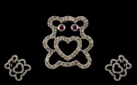 9ct White Gold Diamond And Ruby Set Pendant In The Form Of A Teddybear Fully hallmarked, the eyes