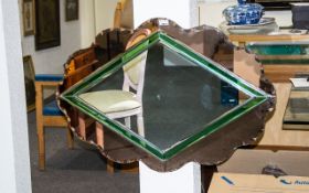 A Large Art Deco Bevelled Glass Mirror Large oval mirror with scalloped,