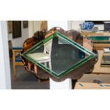 A Large Art Deco Bevelled Glass Mirror Large oval mirror with scalloped,