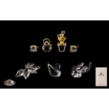 A Collection of Swarovski Crystal Figures comprising 1) Swarovski Silver Crystal Four Leaf Clover