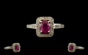 Ladies 9ct White Gold Ruby and Diamond Set Dress Ring, The Central Faceted Ruby of Good Colour,