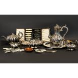 A Mixed Collection Of Plated Metal Ware To include a four piece tea service, embossed trays,