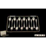 Elkington & Co Excellent Boxed Set of 12 Sterling Silver Rattail Teaspoons.