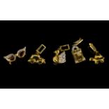A Collection Of Five 9ct Gold And Diamond Set Charms Each hallmarked to bale, to include swan,
