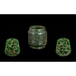 A Carved Jadeite Pendant Talisman Stone Pendant Of shaped form carved with mythical beast amongst