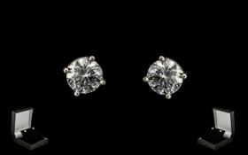 A Pair Of 18ct White Gold Diamond Stud Earrings Each set with a round modern brilliant cut diamond,