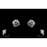 A Pair Of 18ct White Gold Diamond Stud Earrings Each set with a round modern brilliant cut diamond,