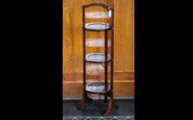 An Early 20th Century Mahogany Three Tier Cake Stand Of typical form with three circular trays and