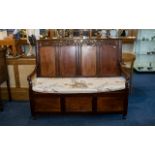 Early 20th Century Carved Oak Monks Bench Panelled back with carved top and hinged seat with