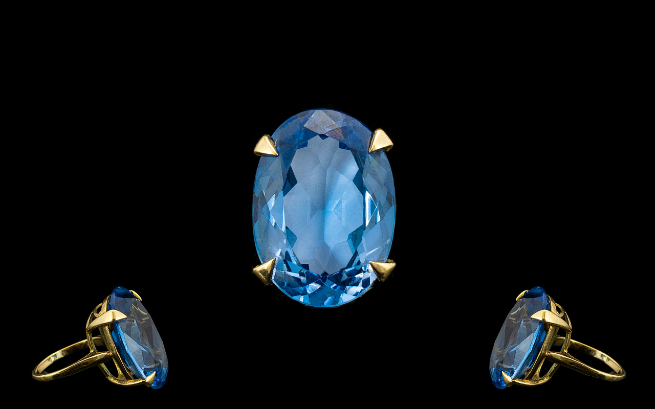 A Superb 9ct Gold Single Stone Blue Topaz Set Dress Ring From The 1960's.