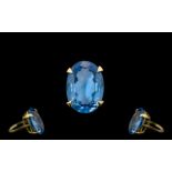 A Superb 9ct Gold Single Stone Blue Topaz Set Dress Ring From The 1960's.