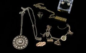 A Small Collection Of Silver Jewellery To include a charm bracelet with five charms and padlock