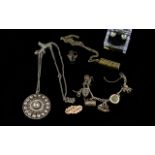 A Small Collection Of Silver Jewellery To include a charm bracelet with five charms and padlock