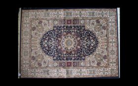 A Large Woven Silk Carpet Keshan rug with blue ground and traditional Middle Eastern floral and