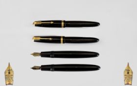 Parker Duofold Black Rubber Cased Fountain Pens - Two in Total. Both with 14ct gold Duofold nibs.