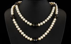 A Cultured Pearl And Topaz Bead Necklace