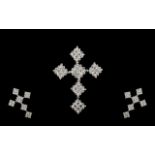 A 9ct White Gold Diamond Cross Fifty fou