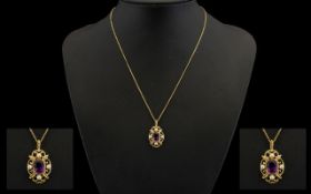 A 9ct Gold Amethyst And Seed Pearl Pendant Necklace Quatrefoil form yellow gold filigree pendant,