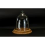 A Large Glass Dome Stand in the Victorian Style, of typical form with oak effect circular base,