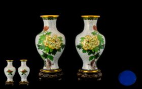 A Pair Of Modern Cloisonne Vases Each of waisted baluster form, raised on carved wooden stands.