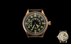 A Modern Replica WWII German Aviation Wrist Watch In copper tone case, glass back,