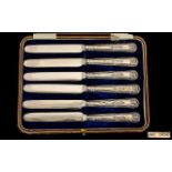 A Boxed Set of Six Ornate Silver Handle Butter Knives with Steel Blades.