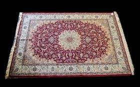 A Large Woven Silk Carpet Keshan rug with beige ground and red border traditional Middle Eastern