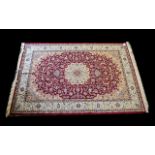 A Large Woven Silk Carpet Keshan rug with beige ground and red border traditional Middle Eastern