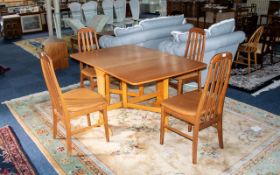 A 1970'S Drop Leaf Table And Four Chairs Of typical form, table when folded 36 x 12 inches,