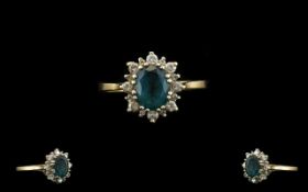 9ct Gold Gem Set Ring set with a blue central stone, surrounded by CZ Fully hallmarked. Ring size U.