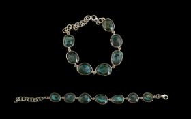 Labradorite Bracelet, comprising seven ovoid labradorites with excellent displays of schiller,