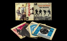 A Collection of Vinyl Single Records including The Beatles, Twist and Shout,