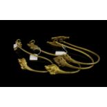 Two Pairs Of Antique Gilt Curtain Tie Backs Crook form hold backs with gilt ormolu finish,
