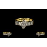 A Stunning Quality 18ct Two Tone Gold Marquise Diamond and Baguette Cut Diamond Ring of