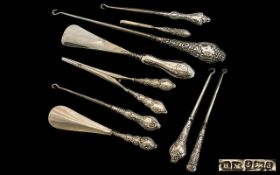 A good Collection of Edwardian Period Ornate Embossed Silver Handle Boot Hooks - Shoe Horns and