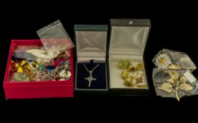 A Small Mixed Lot of Costume Jewellery to include a silver CZ set cross, paste set flower brooches,